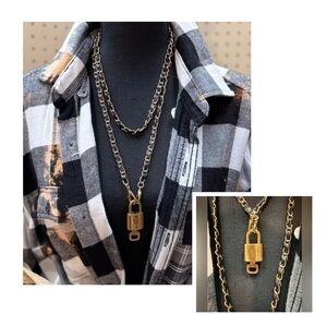 Authentic LV lock on black & gold chain. I have 5 on different chains.